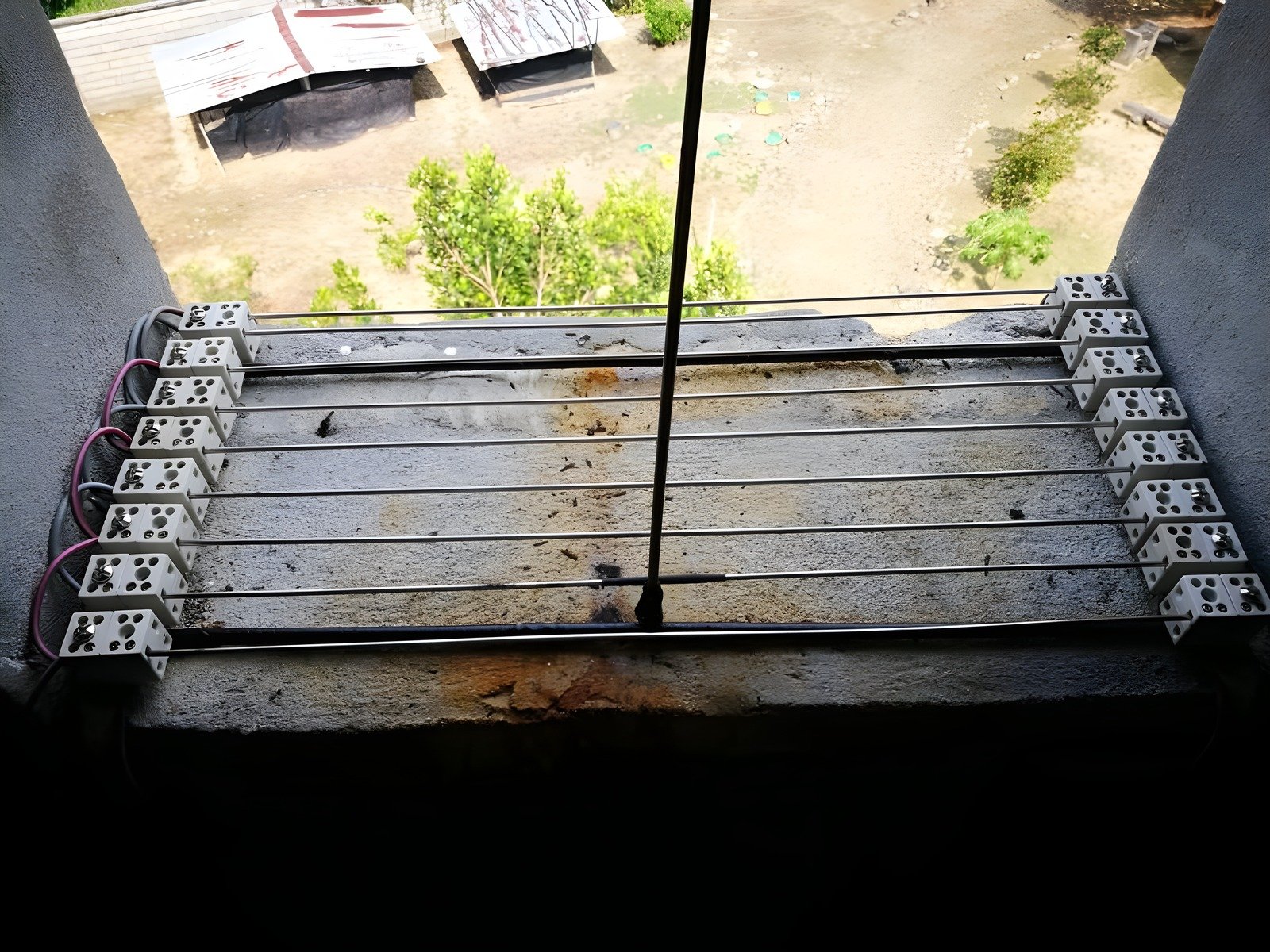 Looking out from inside a swiftlet house at midday: bright daylight outside the entrance hole, pitch dark inside - MDK Swiftlet