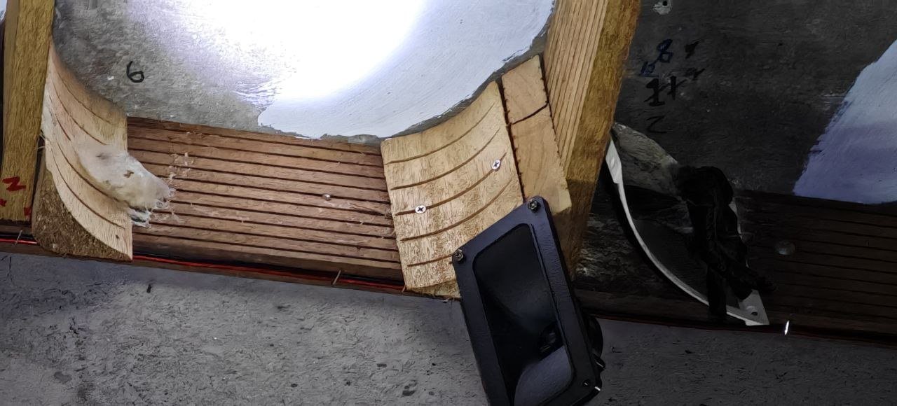 A tweeter at the corner of the nesting planks inside a house